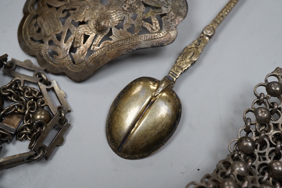 A collection of accessories and a silver spoon, comprising: a Victorian necklace, second half 19th century, composed of a series of links suspending graduated chain festoons and spherical and oval links with pointed pend